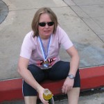 She finished! Notice the medal around her neck! Good work!