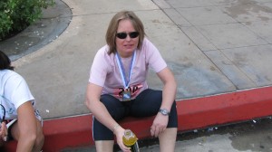 She finished! Notice the medal around her neck! Good work!